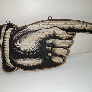 Hand pointing sign